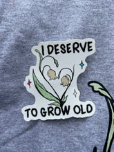 Load image into Gallery viewer, Growing Old Trans CHARITY Sticker
